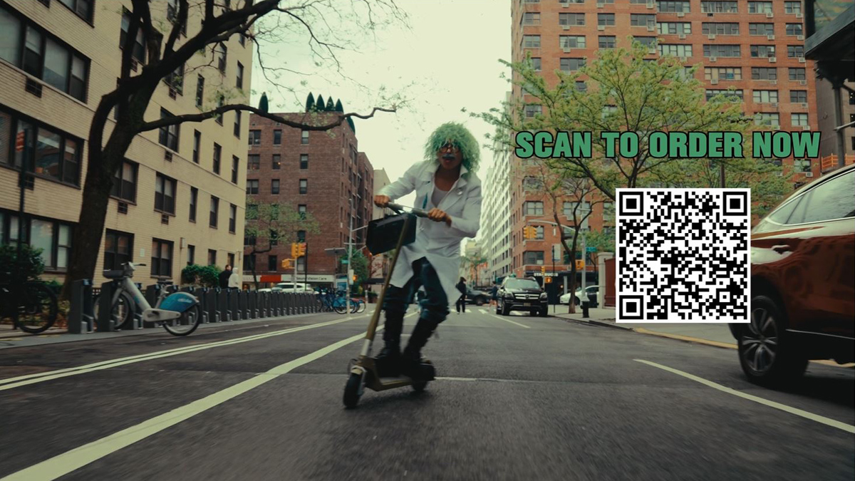 A mad scientist on a scooter in a street