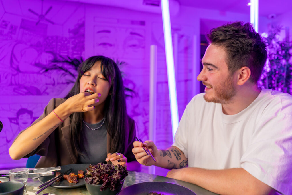 a couple in love eating food while high